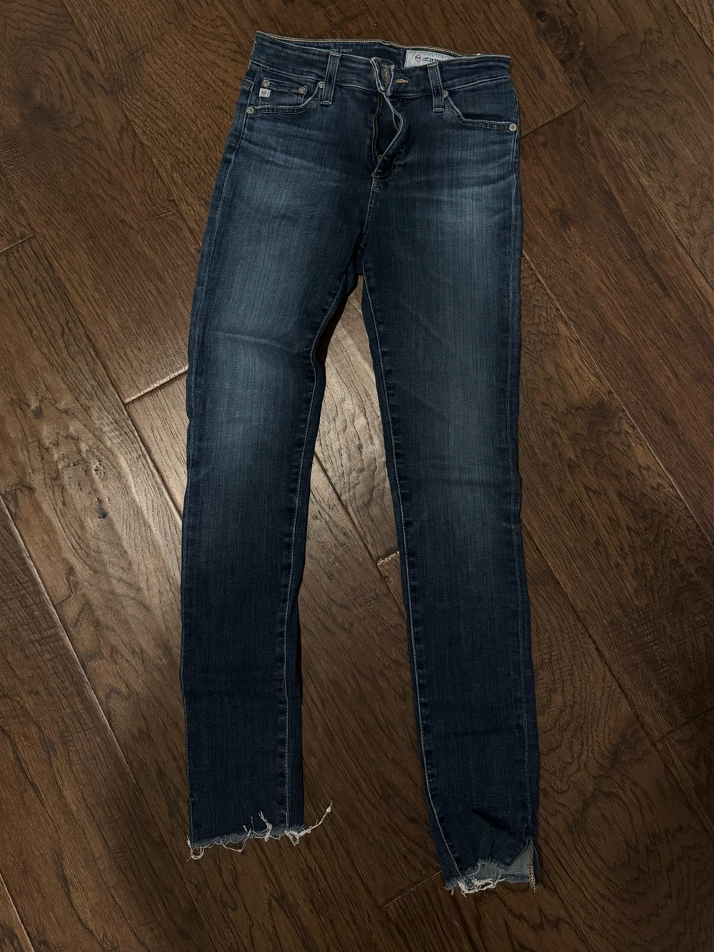 AG size 25 Dark Blue Skinny Jeans with Distressed Hem